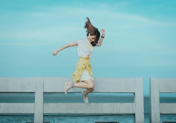 jumpshot-photography-of-woman-in-white-and-yellow-dress-near-884977